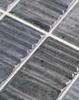 Closeup of Dusty Blue 2x8 Textured Ceramic Subway Wall Tile