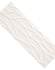 Closeup of a single large white wave pattern 3d tile.