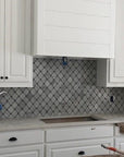 Carrara White Waterjet Mosaic Tile with Grey Marble Accent Dots in Safi Lanterns | TileBuys
