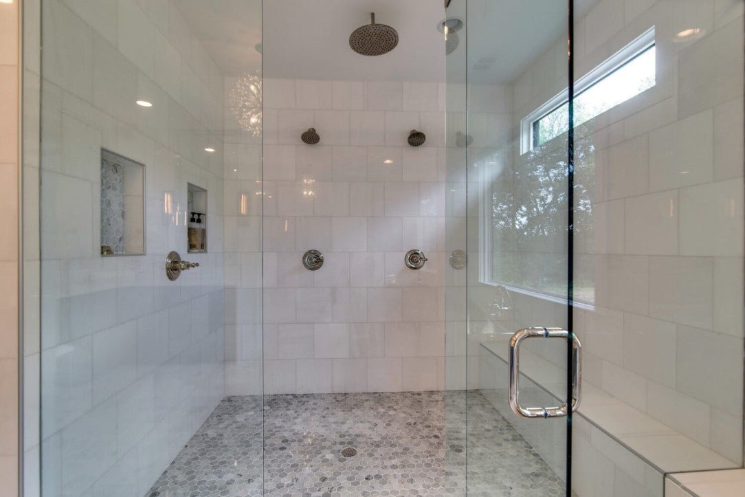 Dual Shower Niches Featuring Hexagon Mosaic Tiles