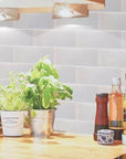 Wooden Kitchen Table with White Glass Subway Tile Backsplash