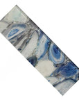 Closeup of a Long Glass Subway Tile with Blue Agate Pattern