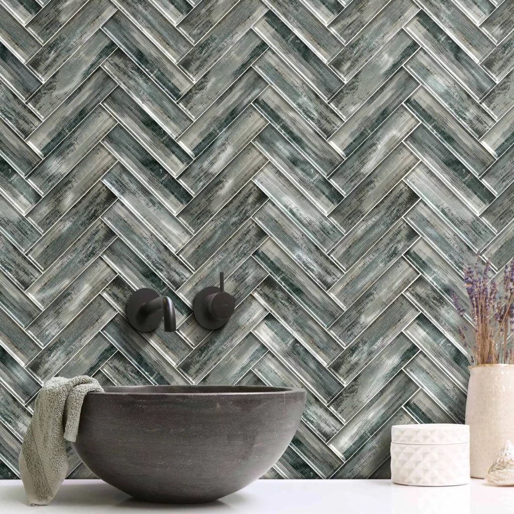 Bathroom Backsplash Featuring Blue Gray Wood Grain Textured Glass Subway Tile in Herringbone Layout Pattern