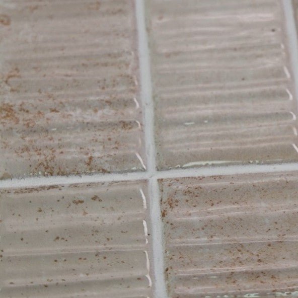 Closeup of Bone Textured Ceramic 2x8 Subway Tiles