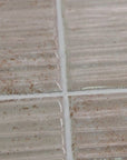 Closeup of Bone Textured Ceramic 2x8 Subway Tiles
