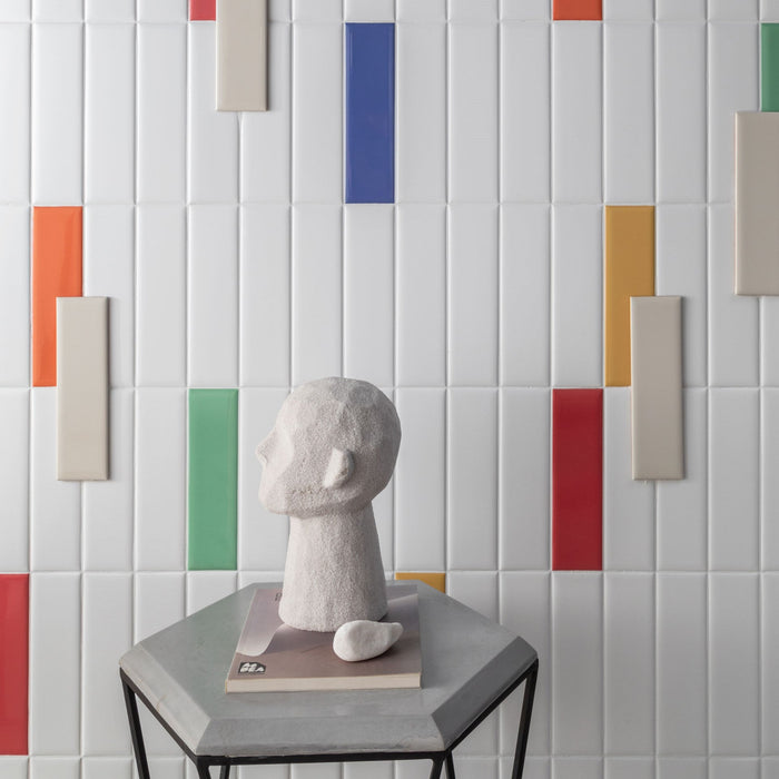 Bright white ceramic subway tile and colorful accent tiles from the Brasilia Subway Tile collection