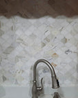 Closeup of Calacatta Marble Arabesque Lantern Tile Backsplash Behind Kitchen Sink