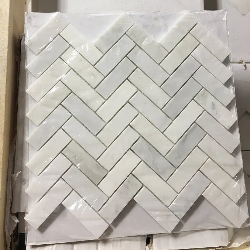 Carrara Venato Marble 1x3 Herringbone Mosaic Tile in Packaging