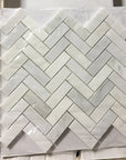 Carrara Venato Marble 1x3 Herringbone Mosaic Tile in Packaging