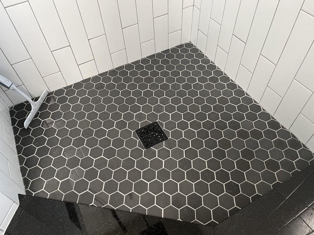 Closeup of Multi Finish Porcelain Charcoal Gray Hexagon Mosaic Tile Shower Floor 