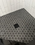 Closeup of Multi Finish Porcelain Charcoal Gray Hexagon Mosaic Tile Shower Floor 