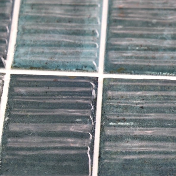 Closeup of Turquoise Textured 2x8 Subway Wall Tiles