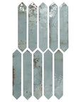 Closeup of distressed look aqua blue picket tiles
