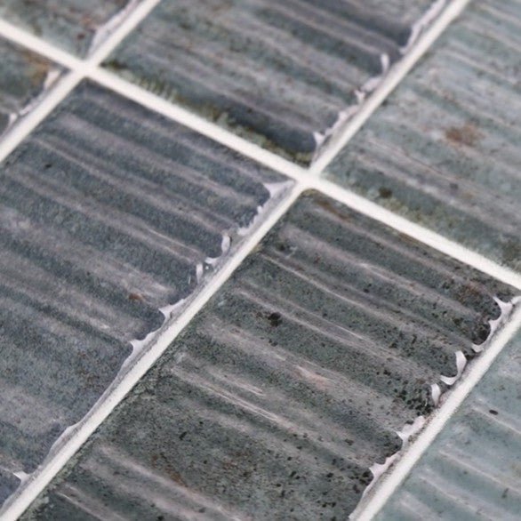 Closeup of Dusty Blue 2x8 Textured Ceramic Subway Wall Tile