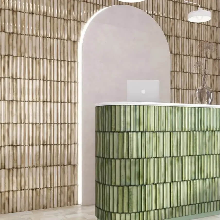 Beige Kit Kat Tile Wall Behind Green Tiled Reception Desk