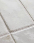 Closeup of White Ceramic 2x8 Subway Wall Tiles