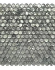 Closeup of a Penny Rounds Mosaic Tile in Blue Gray Textured Glass