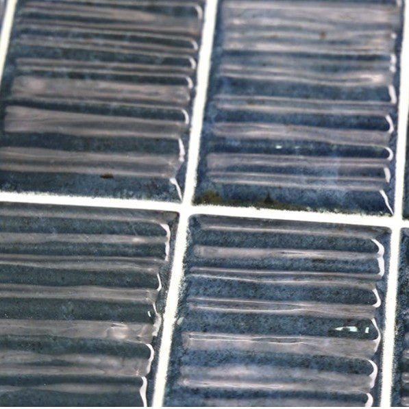 Closeup of Marine Blue Textured 2x8 Ceramic Subway Tiles