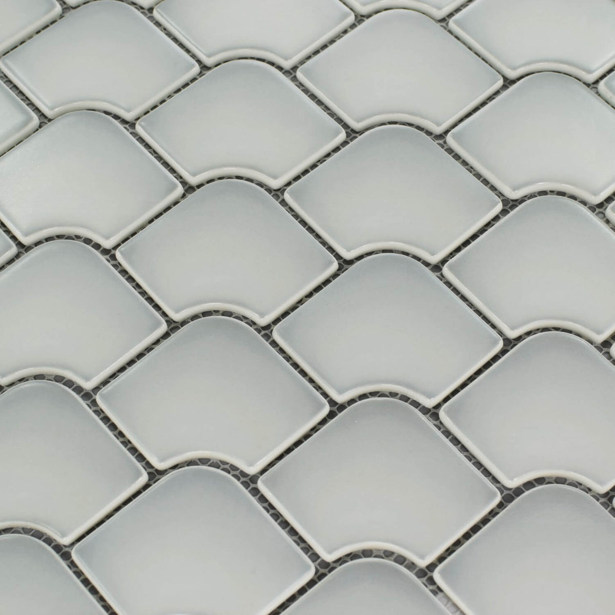 Closeup of matte glass mini fan mosaic tile in cotton white 