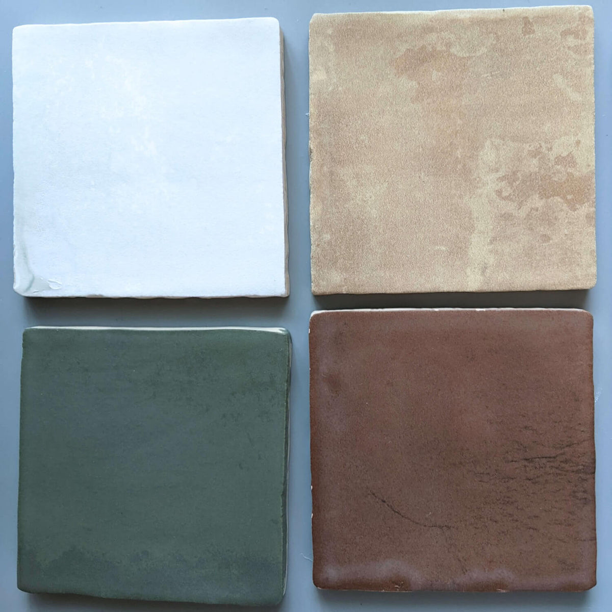4x4 Terracotta Ceramic Tiles in Four Colorways Under Natural Lighting