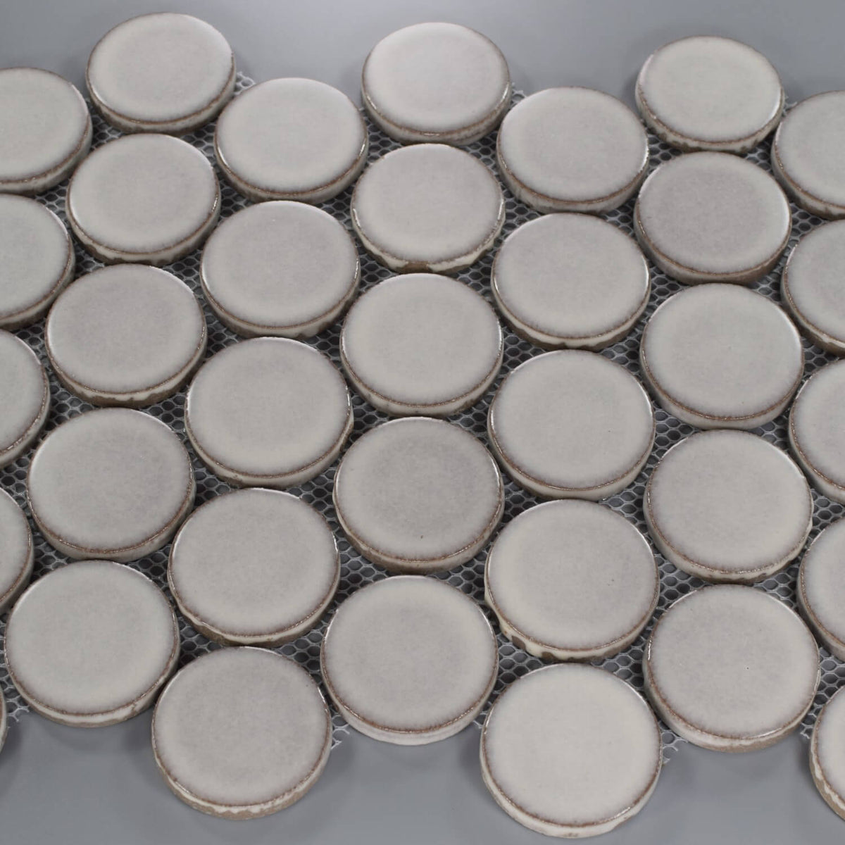 Closeup of Matte Silver Gray Penny Mosaic Tile