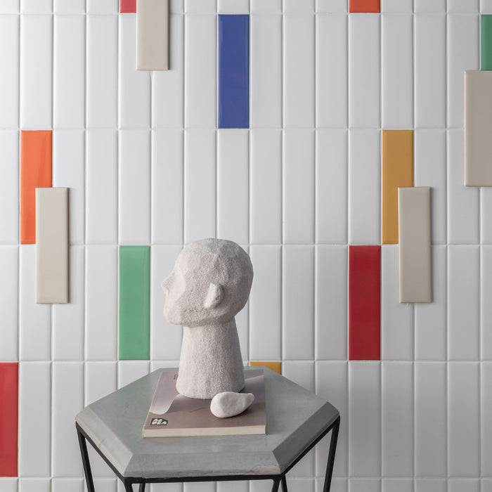 Bright white ceramic subway tile and colorful accent tiles from the Brasilia Subway Tile collection