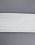 Closeup of a 3x12 White Pearlescent Glazed Glass Subway Tile