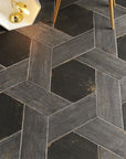 Closeup of Floor Tiled in Black Hexagons Outlined by Gray Wood Look Tile