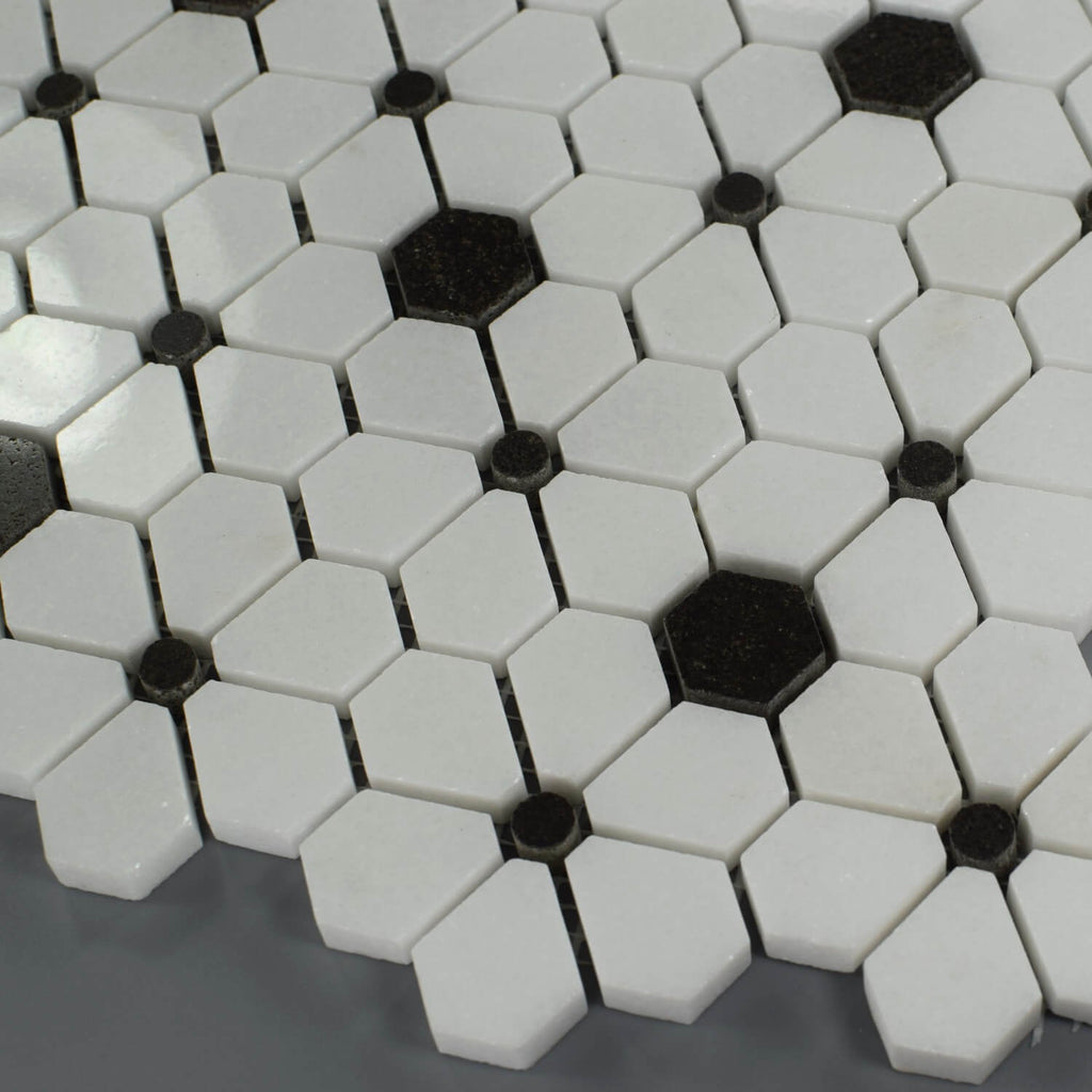 Closeup of White Flower Tile with Black Hexagon and Dot Accents