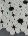 Closeup of White Flower Tile with Black Hexagon and Dot Accents