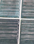 Closeup of Turquoise Textured 2x8 Subway Wall Tiles