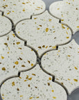 Closeup of White and Gold Terrazzo Arabesque Lantern Mosaic Tile