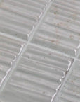 Closeup of Textured White Ceramic Subway Wall Tiles
