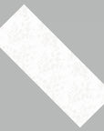 Closeup of white ceramic with floral motif