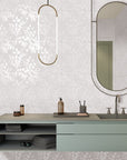 Bathroom vanity and mirror with white floral tile walls
