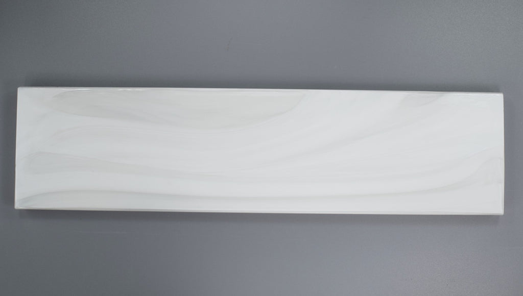 Closeup of a 3x12 White Pearlescent Glazed Glass Subway Tile